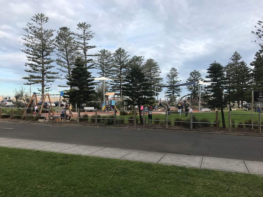 The park separates you from the beach it has all the play equipment that kids love
