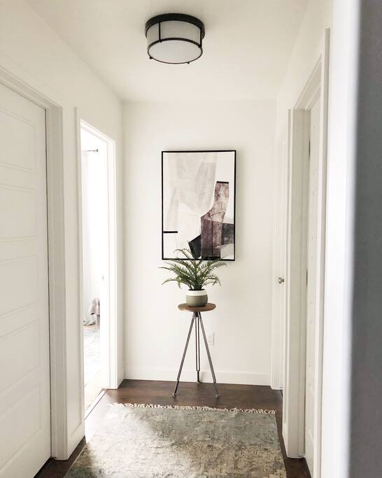 Here is the private hallway. First door on the left is the bathroom and the second door on your left is your bedroom.