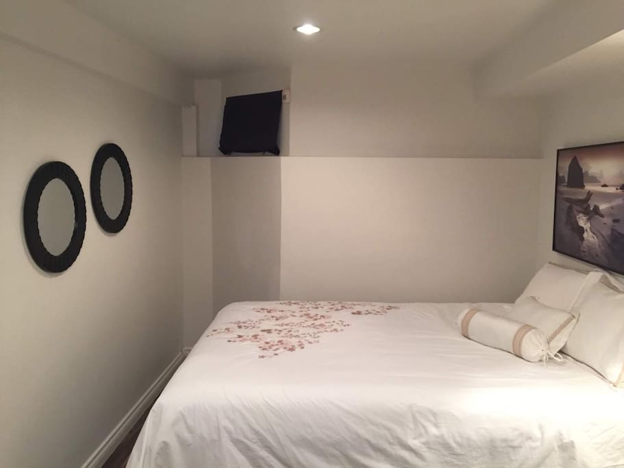New Queen bed and clean bedsheets for your comfort.