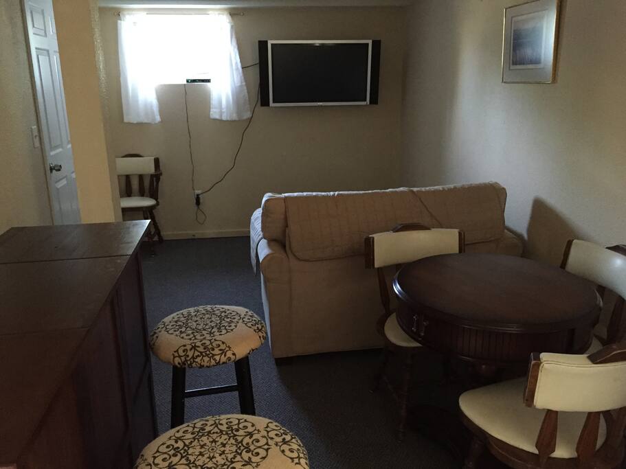 Large open space living, dining, and kitchenette/laundry area.