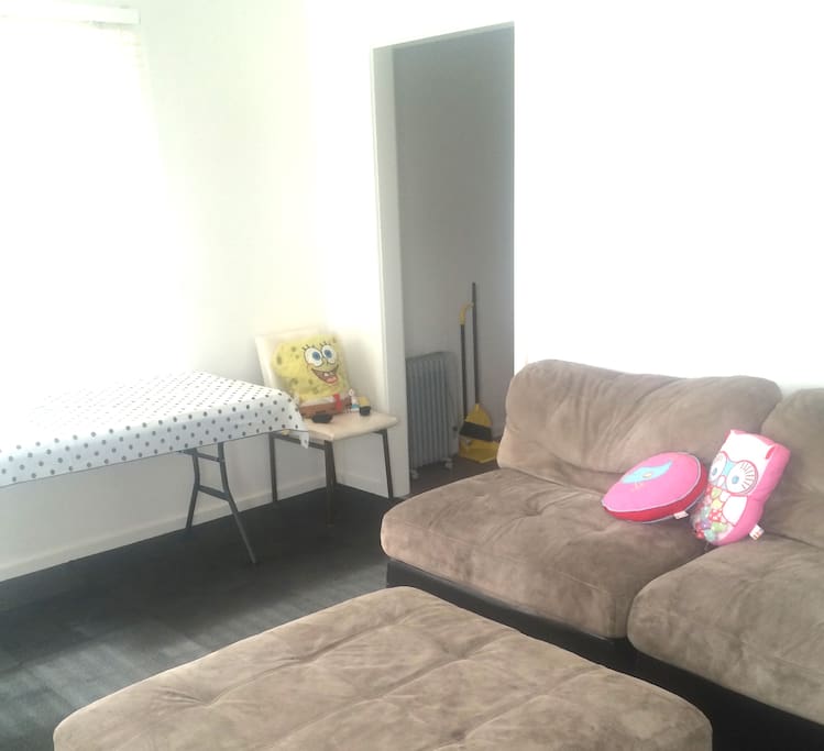 Living room 2 /kids zone with Apple TV. Table for quick eats off the kitchenette.