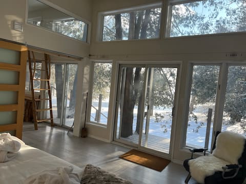 Idyllic waterfront home with hot tub, hygge style