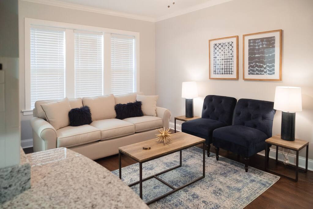 The living room features a couch you'll sink right into