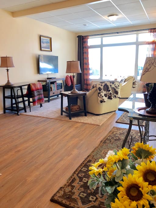 View of the living room common area, is spacious and clean with cozy, relaxing “Alaska cabin chic” decor. Our unit is barrier free providing easy wheelchair access and it has 3.0 wide doors.