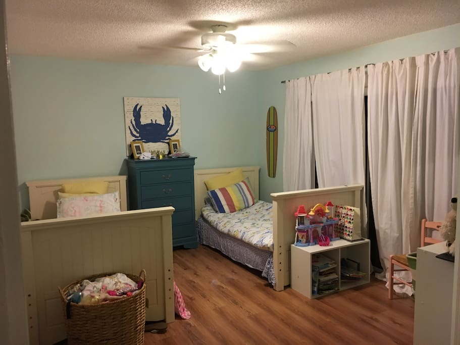 Guest bedroom with twin beds and has its own bathroom.