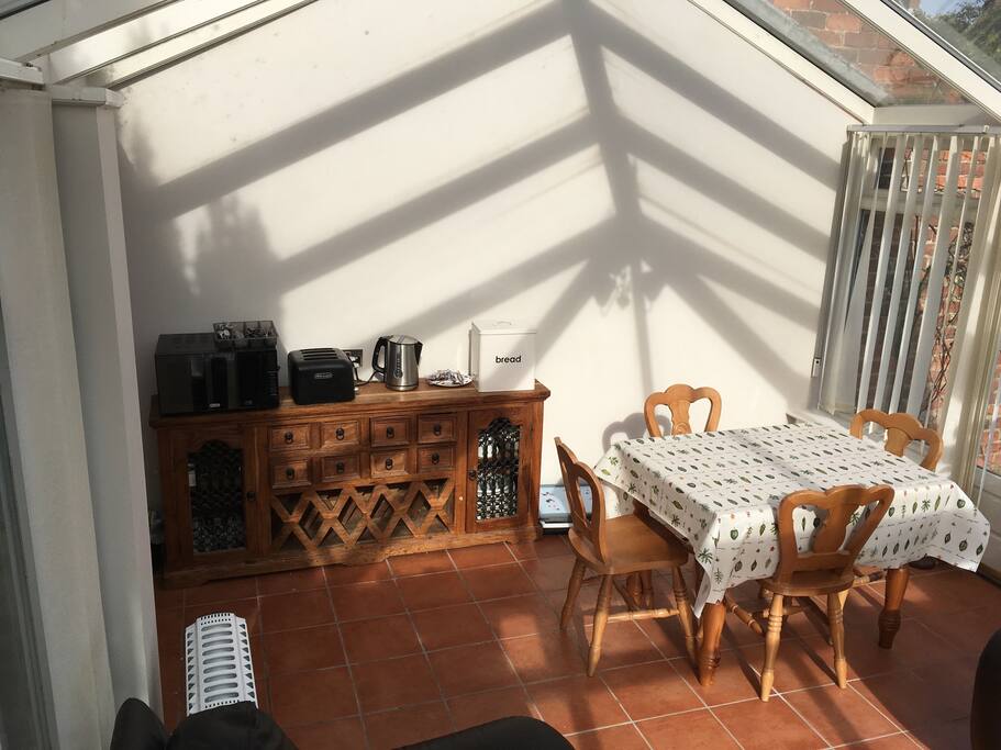 Comfortable dining/seating area with kettle, toaster, microwave, crockery, cutlery, fridge / freezer....