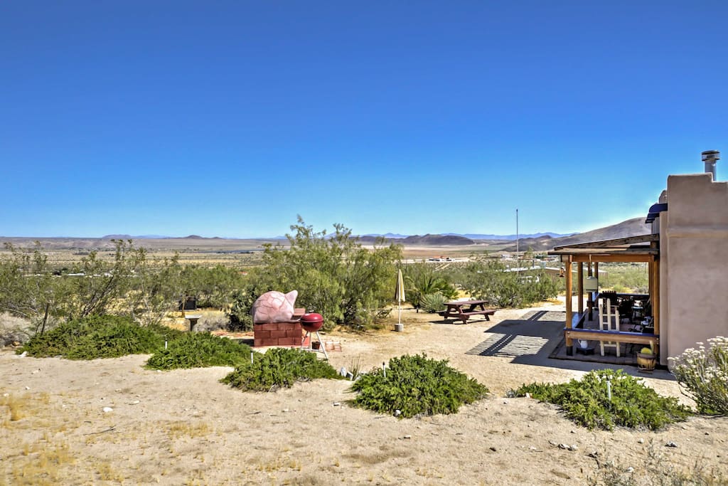 This adobe style home is situated on 2.5 acres of land and offers views of amazing rock formations and the Joshua Tree National Park.