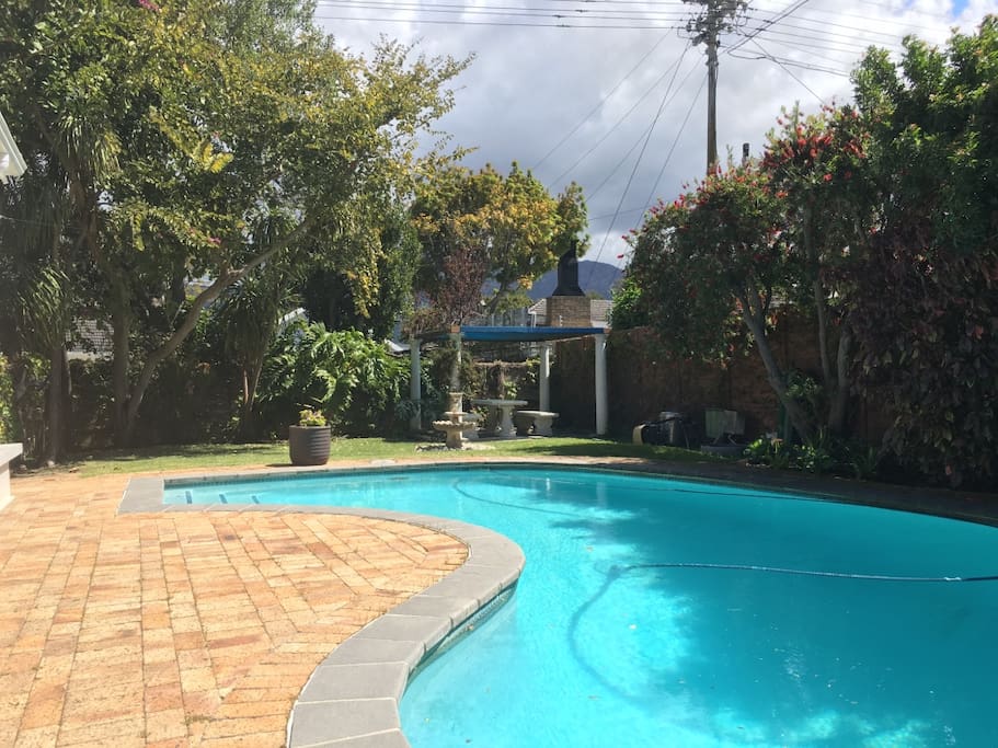 Large pool and outside area with BBQ and weber.