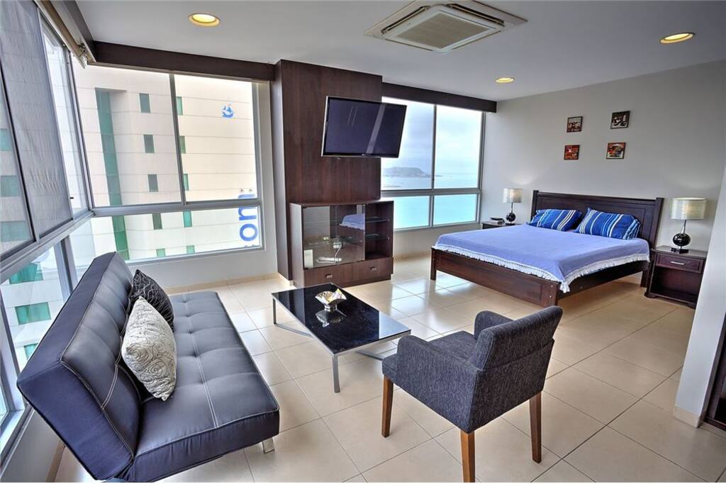 living area and queen bed