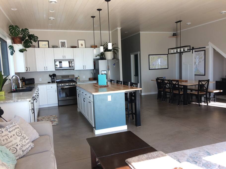 Open concept kitchen, dining and living space