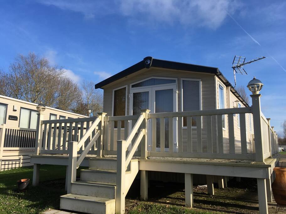 Caravan and decking in front of Kingfisher lake