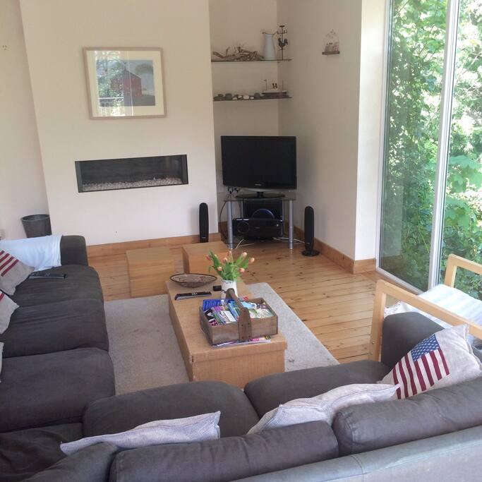 Spacious lounge with L shaped sofa