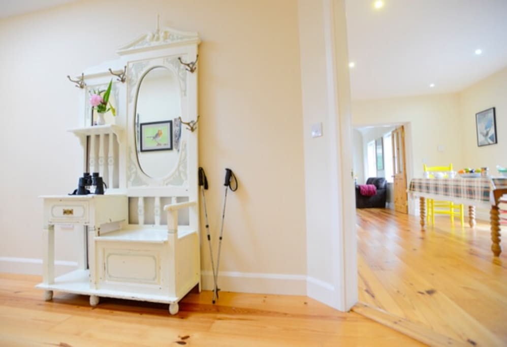 Hall area with pine wood floors throughout.