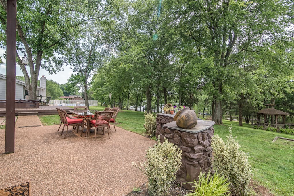 Look out over a sprawling yard from the patio.
