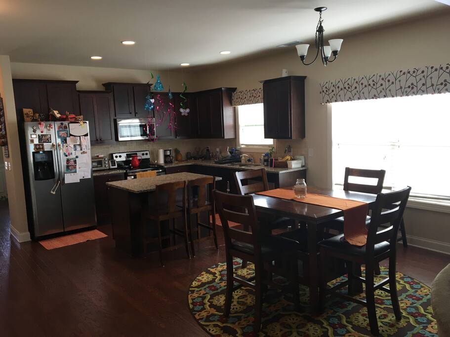 Open floor plan. Seating at the kitchen island and a larger table with folding leaves.