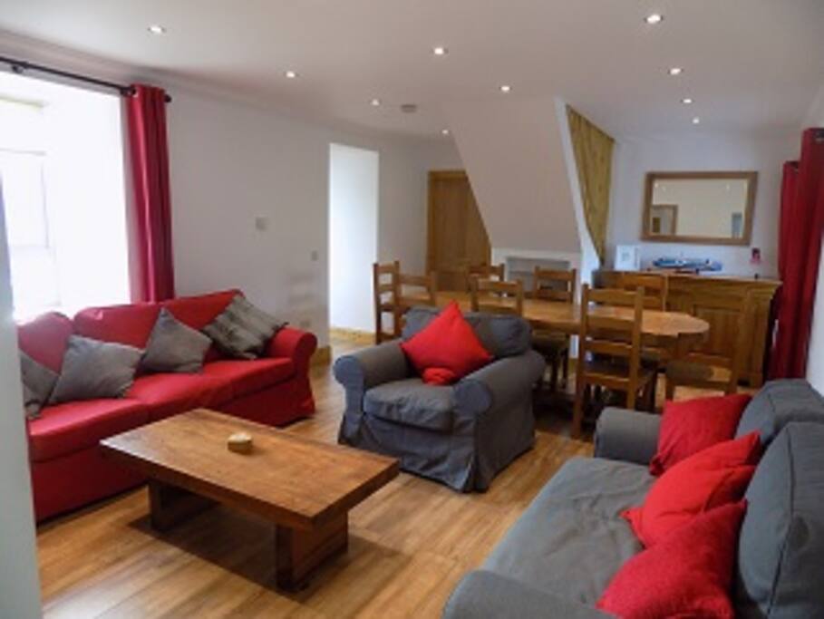 Living room with dining area, dining table can sit 10 people