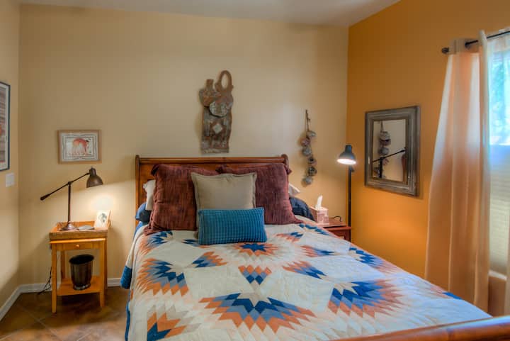 The Spirit of the Southwest Bedroom has Earth Tones with Hints of Reds and Blues.  Upgraded Linens and SMART TV and Ceiling Fan