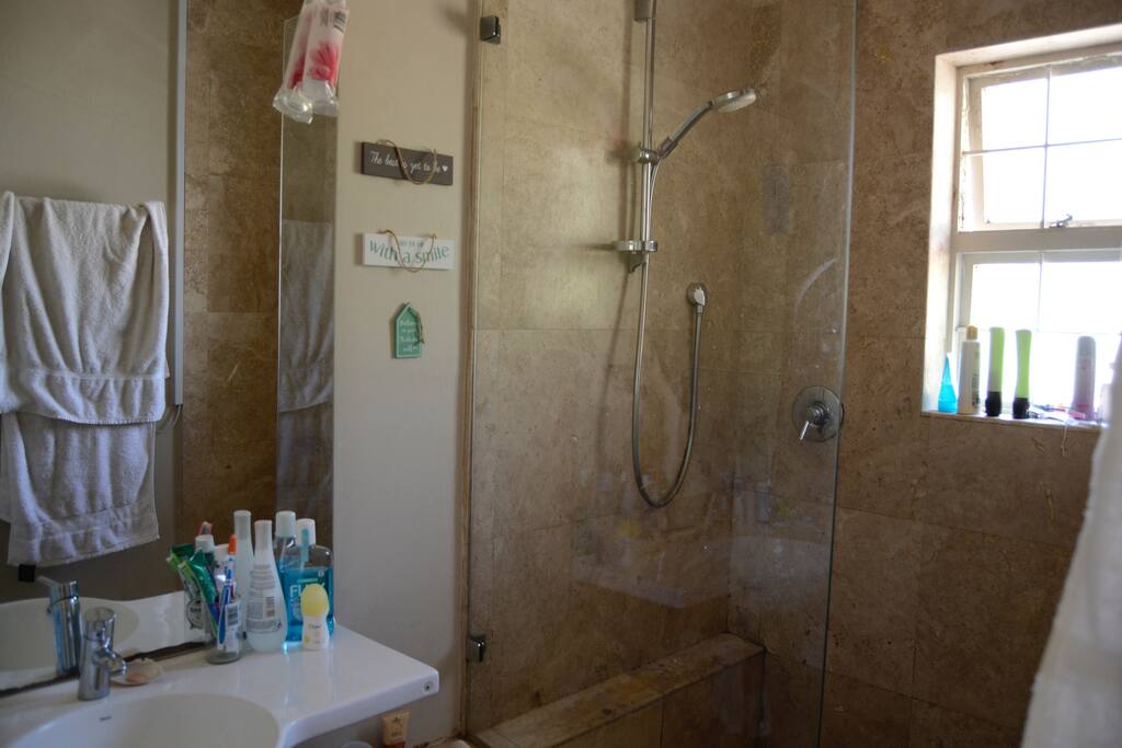 Shared bathroom with shower.