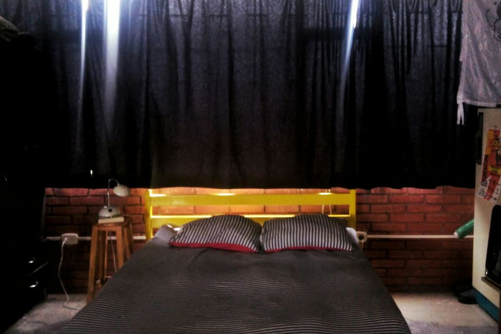 Nice bed, next to a wide window. We have dark courtains in case you want to sleep over the day.