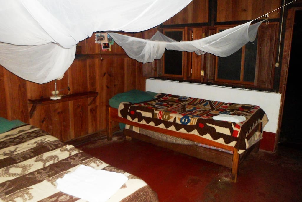 The room has 2 single bed and one small bed to pull out for a third person.
