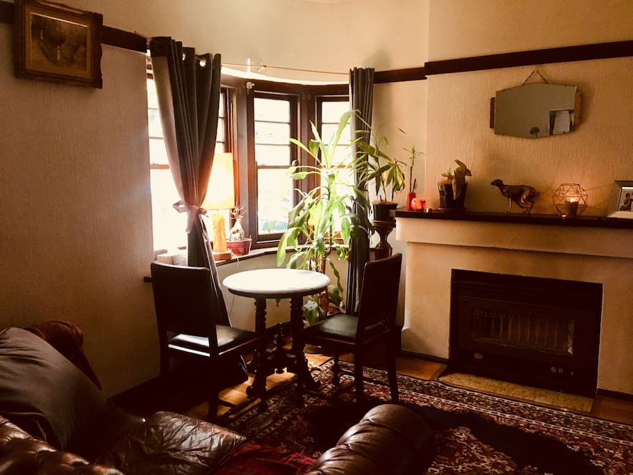 Beautiful sun lit lounge room with cable TV