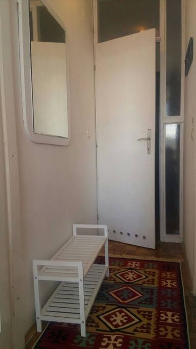 Short hallway that separates guest area from the rest of flat, and leads to bedroom (behind the back) and bathroom (right) you get a key for your part of the flat(front)