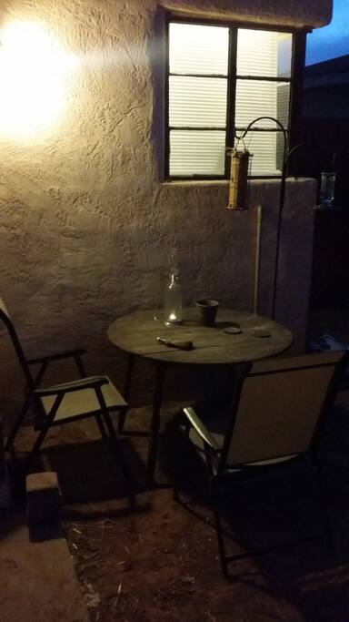 humble outdoor nook at the service of smokers and birds