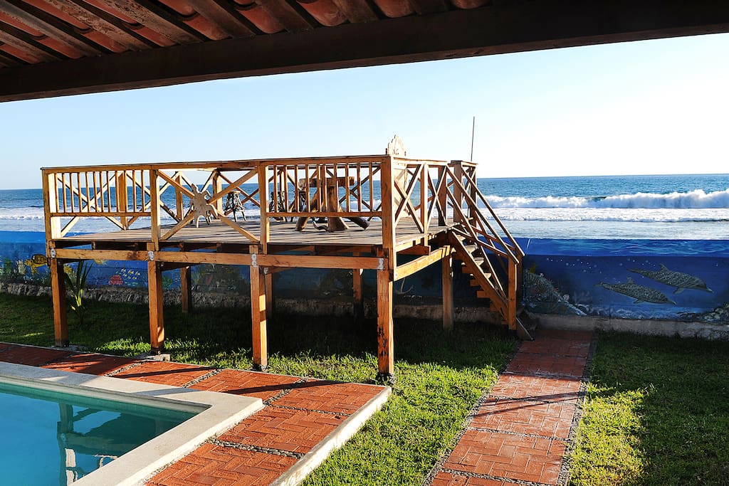 Wooden deck and with the Pacific Ocean in the background