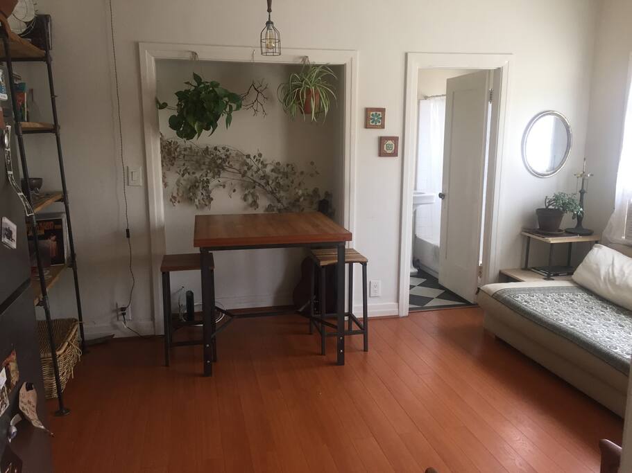 Dining table, couch, bathroom.
