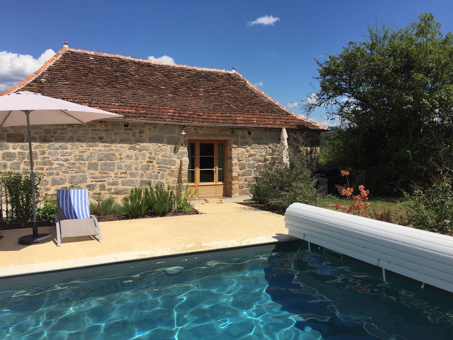 Landscaping around the house and pool (with herb garden) makes for a beautiful setting.