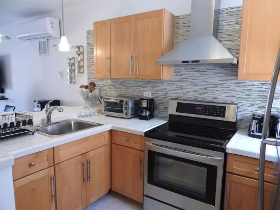 Wow! Eye catching updated kitchen with new appliances and garbage disposal