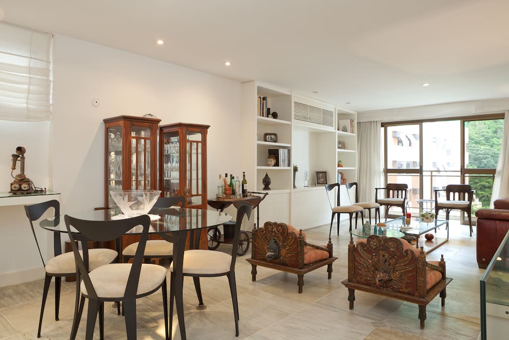 Open space living and dining room with large balcony