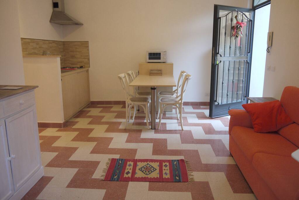 soggiorno con angolo cottura