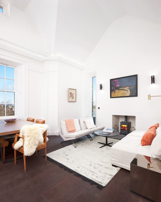 Double height space in the Lounge, with wood burning stove