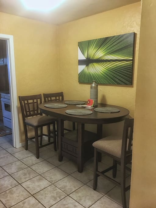 Dining table comfortably seats 4.