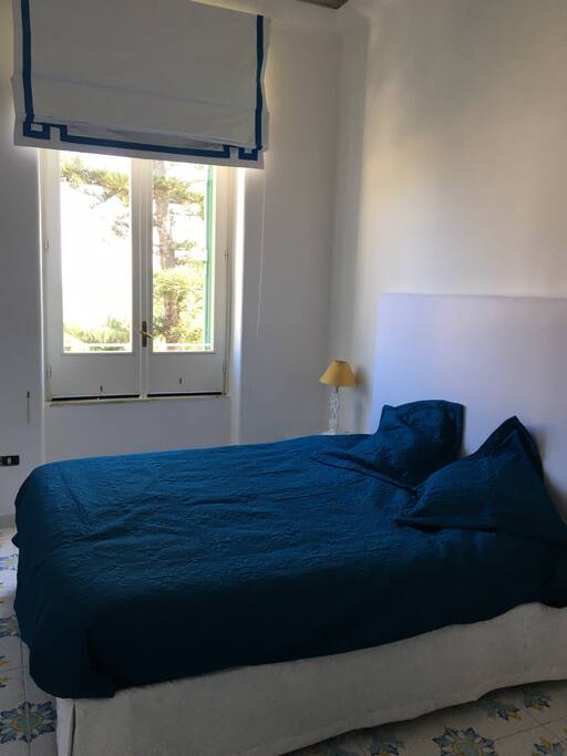 Your bedroom with a view of the sea and direct access to the balcony