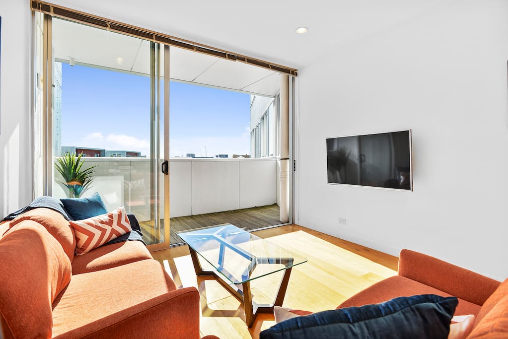 Sun streams in through the north facing floor to ceiling double stacking ranch sliders.