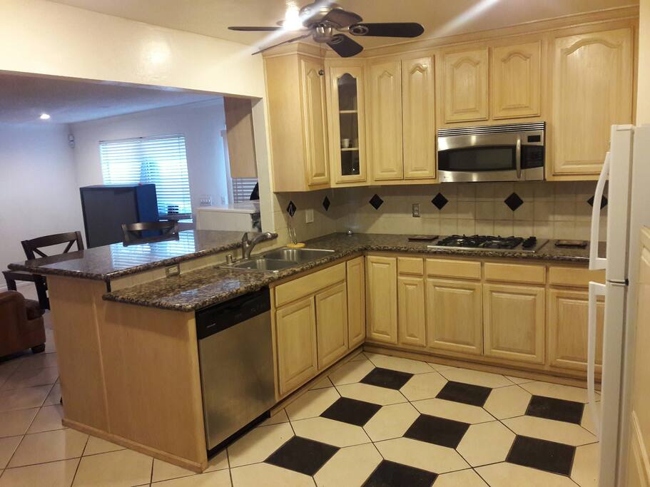 open Kitchen custom cabinets and build in appliances family room adjacent