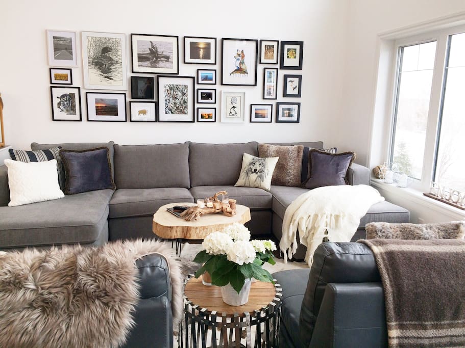 Snuggle up with a good book and enjoy the fabulous view. We hope you enjoy our art gallery wall we’ve collected from many local talented artists.