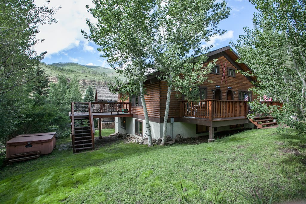 Deck with Hot Tub in yard.