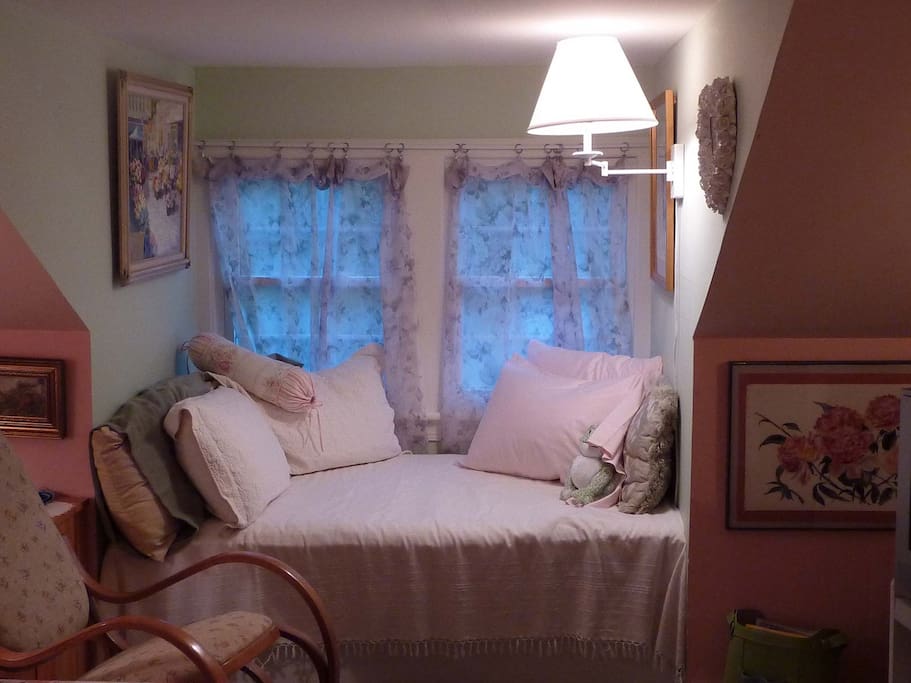 Window seat is slightly shortened twin mattress.