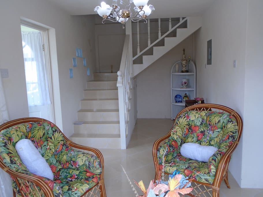 A welcoming interior - the Foyer and a view of the tiled staircase.