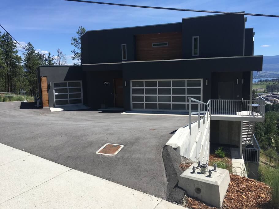 Front of house with guest parking to left