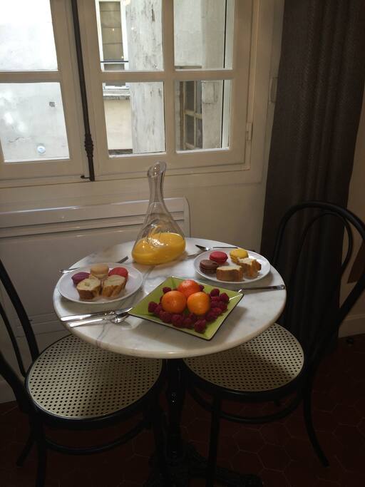 A Parisian bistro table provides the perfect setting to enjoy all of the local fresh baked goods, and produce from the markets next door.