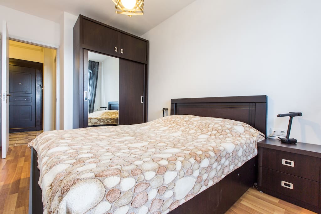 Bedroom full of light with a small balcony