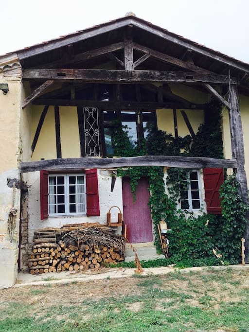 Old Eastern facade with door to old kitchen, now sitting room