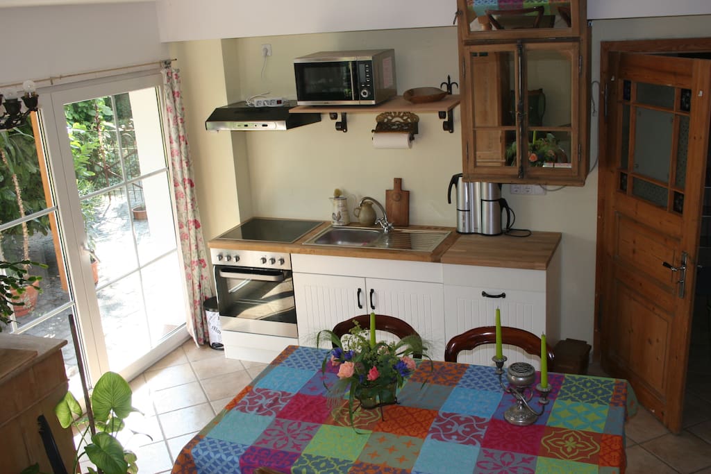 From the small, but convenient kitchen with oven, dishwasher and microwave you have direct access to our country-style garden, which is enclosed.