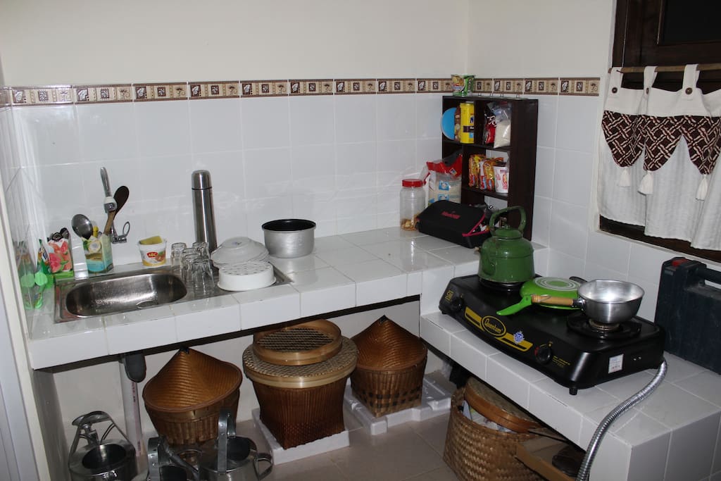 small kitchen, with a sink, a gas stove.