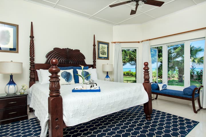 Bedroom #5     16x18 feet
Four-poster mahogany King bed, en suite bathroom, a/c, ceiling fan, bay windows, garden, pool, and turquoise Caribbean Sea views 


