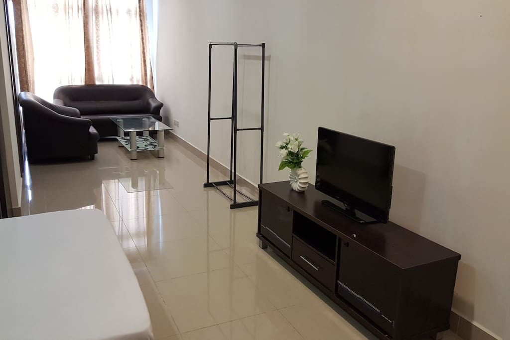 Studio Room with Queen Size bed and sofa set, TV and air-conditioner